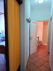 a hallway with a yellow curtain in a room at Gest Short Rent Siena 5 in Siena