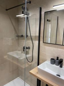 a bathroom with a shower and a sink at Beach Apartments Ankora in Makarska