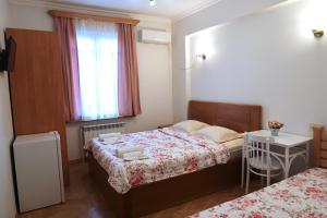 Postel nebo postele na pokoji v ubytování guest house Merci