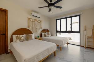 Ένα ή περισσότερα κρεβάτια σε δωμάτιο στο Casa 4 recamaras, alberca, terraza y club playa. +15 φωτογραφίες