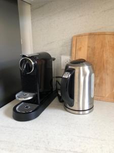 a coffee maker and toaster on a kitchen counter at Appartement catalan coeur village-intégralement rénové in Argelès-sur-Mer