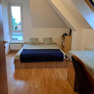 Postel nebo postele na pokoji v ubytování Zöld Orom Apartman Lakás