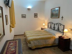 Posteľ alebo postele v izbe v ubytovaní Agriturismo Villa Luca