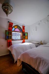 Letto o letti in una camera di Riad Bab Mahruk