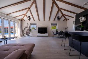a living room with a couch and a table at Villa Mirage with Private Heated Pool in Orebić