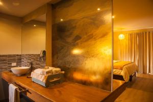 a bathroom with a sink and a mirror at Lamay Lodge in Cusco