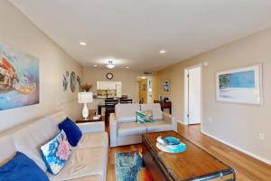 a living room with a couch and a table at The Palm Bay Club Unit 311 in Siesta Key