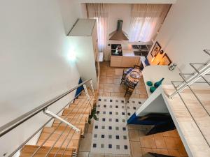an overhead view of a staircase in a house at CasaBlu in Cormano