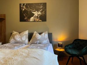 En eller flere senge i et værelse på 3144 Ferien am SCHLOSS WALD Ap DAVINCI