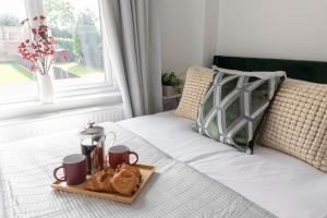 Postel nebo postele na pokoji v ubytování Lythwood House