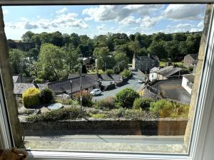 a view of a residential neighborhood from a window at A Cosy Flat With A Dales View in Ingleton