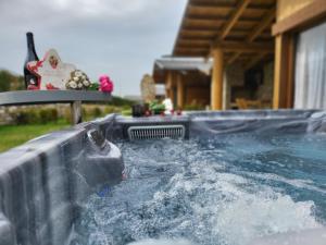 a water slide in a pool of water at Boutique Holiday Pirin Golf in Razlog