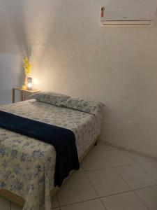 Postel nebo postele na pokoji v ubytování Suíte São Benedito