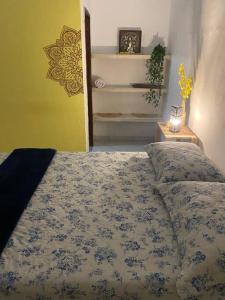 Postel nebo postele na pokoji v ubytování Suíte São Benedito + 2 fotografie