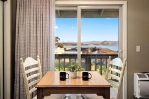 a dining room table with a view of the ocean at Sea Pines Golf Resort in Los Osos