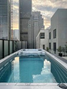 a large swimming pool on top of a building at Stuning penthouse old montreal in Montreal