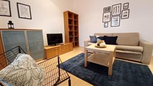 a living room with a couch and a table at Apartments Daria in Krk
