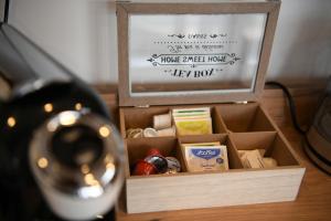 a wooden box filled with different types of food at Natura Bungalow in Ždrelo