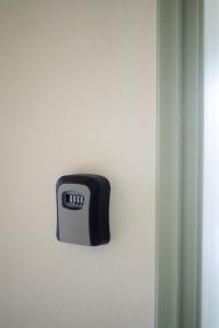 a black and white object on a wall at Sainis Rooms in Selianitika