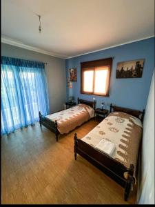 Ліжко або ліжка в номері Eretria Homestay