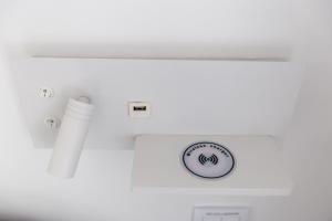 a bathroom with a white tub and a sink at Urban Loft in Porto