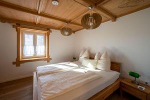 Postel nebo postele na pokoji v ubytování Bauern-Ferienhaus-im-Allgaeu