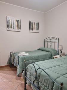 Postel nebo postele na pokoji v ubytování Villa Gramati