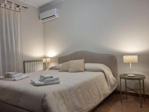 Postel nebo postele na pokoji v ubytování Villa Gramati