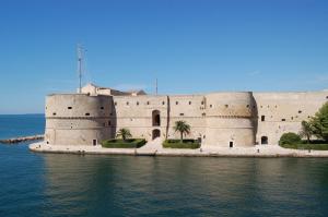 a building on a island in the water at BELLO BORGO in Taranto