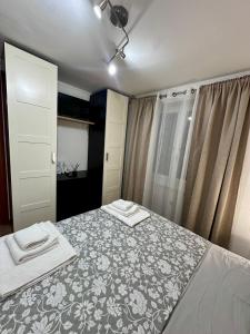 a bedroom with a bed with two towels on it at BELLO BORGO in Taranto