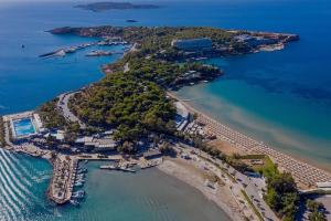 an aerial view of a beach with a resort at Kavouri Seaside 85sqm Apartment 5' from the beach in Athens