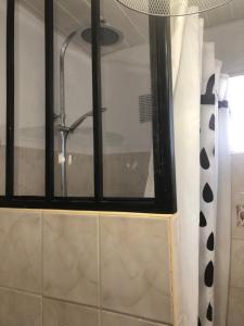 a bathroom with a window and a shower at Appartement T2 in Six-Fours-les-Plages