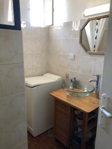 a bathroom with a sink and a toilet at Appartement T2 in Six-Fours-les-Plages