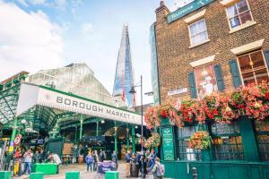 a view of borough market with the shard in the background at 25 Percent OFF Monthly Stays, Business Family Sleeps 4, Best for Long Term Stays in London