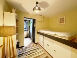 a small bedroom with a bed and a hallway at 25 Percent OFF Monthly Stays, Business Family Sleeps 4, Best for Long Term Stays in London