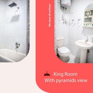 Pyramid stars inn في القاهرة: حمام به مرحاض أبيض ومغسلة