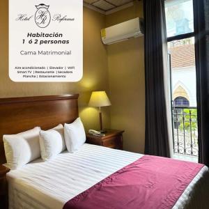 a hotel room with a bed and a window at Hotel Reforma Tuxpan in Tuxpan de Rodríguez Cano