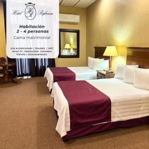 Posteľ alebo postele v izbe v ubytovaní Hotel Reforma Tuxpan
