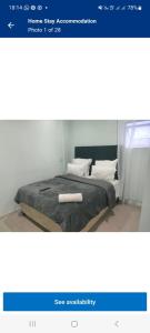 a picture of a bed in a room at AR : Homestay Accommodation Goodwood in Cape Town