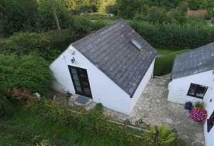 an aerial view of a white house with a roof at A cosy hideaway on the Jurassic Coast in Lyme Regis