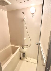 a shower in a bathroom with a bath tub at Purezant - Vacation STAY 37459v in Orio