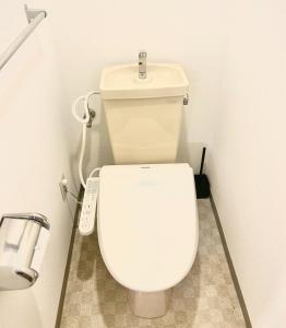 a bathroom with a white toilet with a remote control at Purezant - Vacation STAY 37459v in Orio