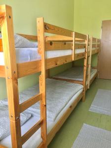 a couple of bunk beds in a room at Budova U dvojice in Nové Město na Moravě