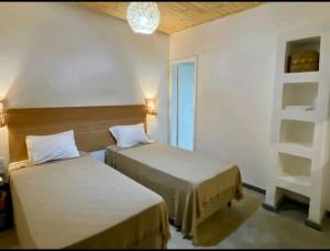 Pousada Panorama Cipo tesisinde bir odada yatak veya yataklar