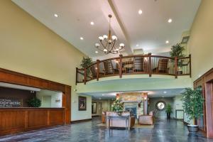 a lobby with a staircase and a waiting room at Silver Rock by StayIn in Fernie