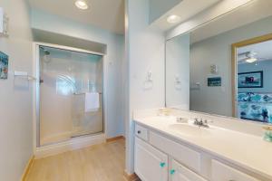 a bathroom with a sink and a shower at Argonauta #27-2 in Avon +18 photos