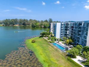 an aerial view of a large apartment building next to a river at Laguna cassia residences in Bang Tao Beach