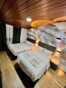 Postel nebo postele na pokoji v ubytování Bonita Hotel