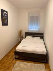 Postel nebo postele na pokoji v ubytování Anči apartmani