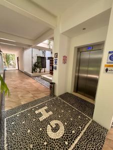 an elevator lobby with a number on the floor at Golf & Beach Haven in Tulum